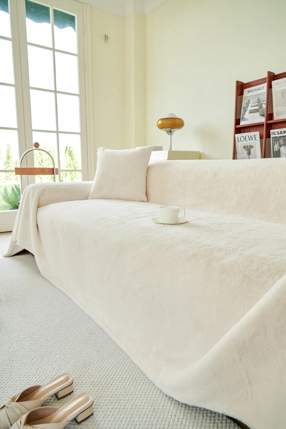 A light-filled sitting room with a cream sofa and natural details